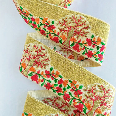 Beige Fabric Trim With Intricate Floral And Trees Embroidery In Gold, Red, Green And Orange Thread